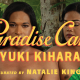 A photograph of two people standing in front of trees and plants. The person on the left is holding a plate of food. There is yellow text across the image reading Paradise Camp by Yuki Kihara, curated by Natalie King. There is a logo in the bottom left corner that is a yellow square reading New Zealand at Venice.